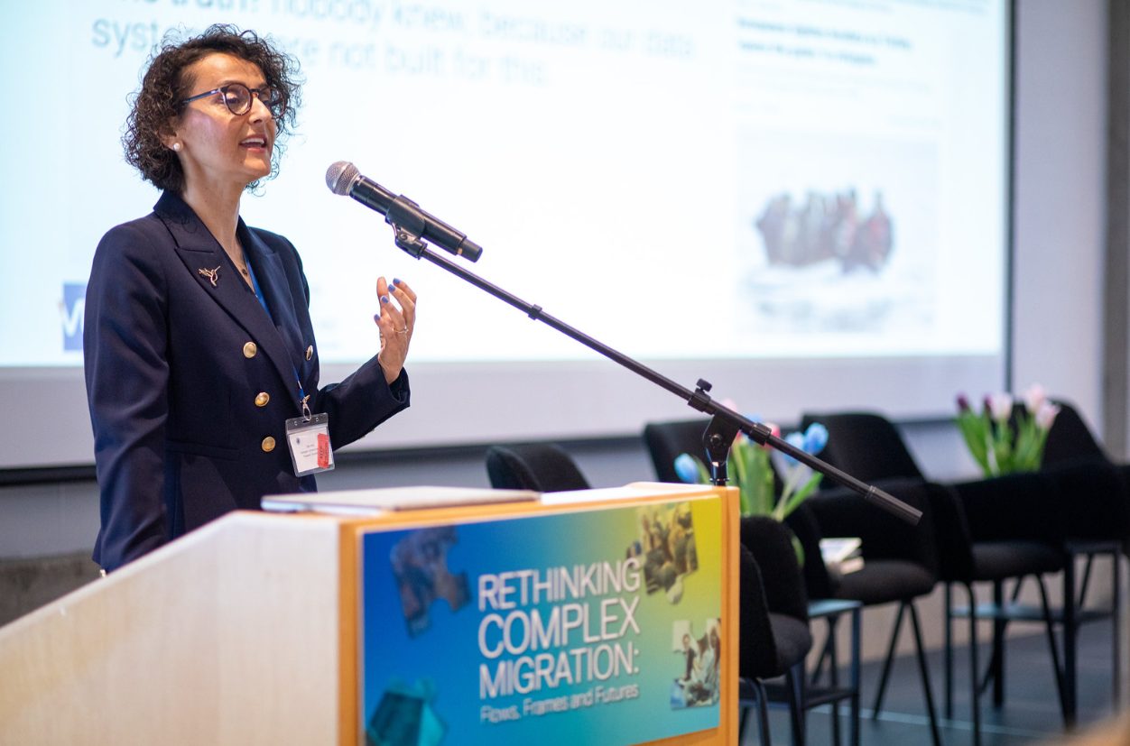 Tuba Bircan giving a talk at a lectern at the Rethinking Complex Migration conference